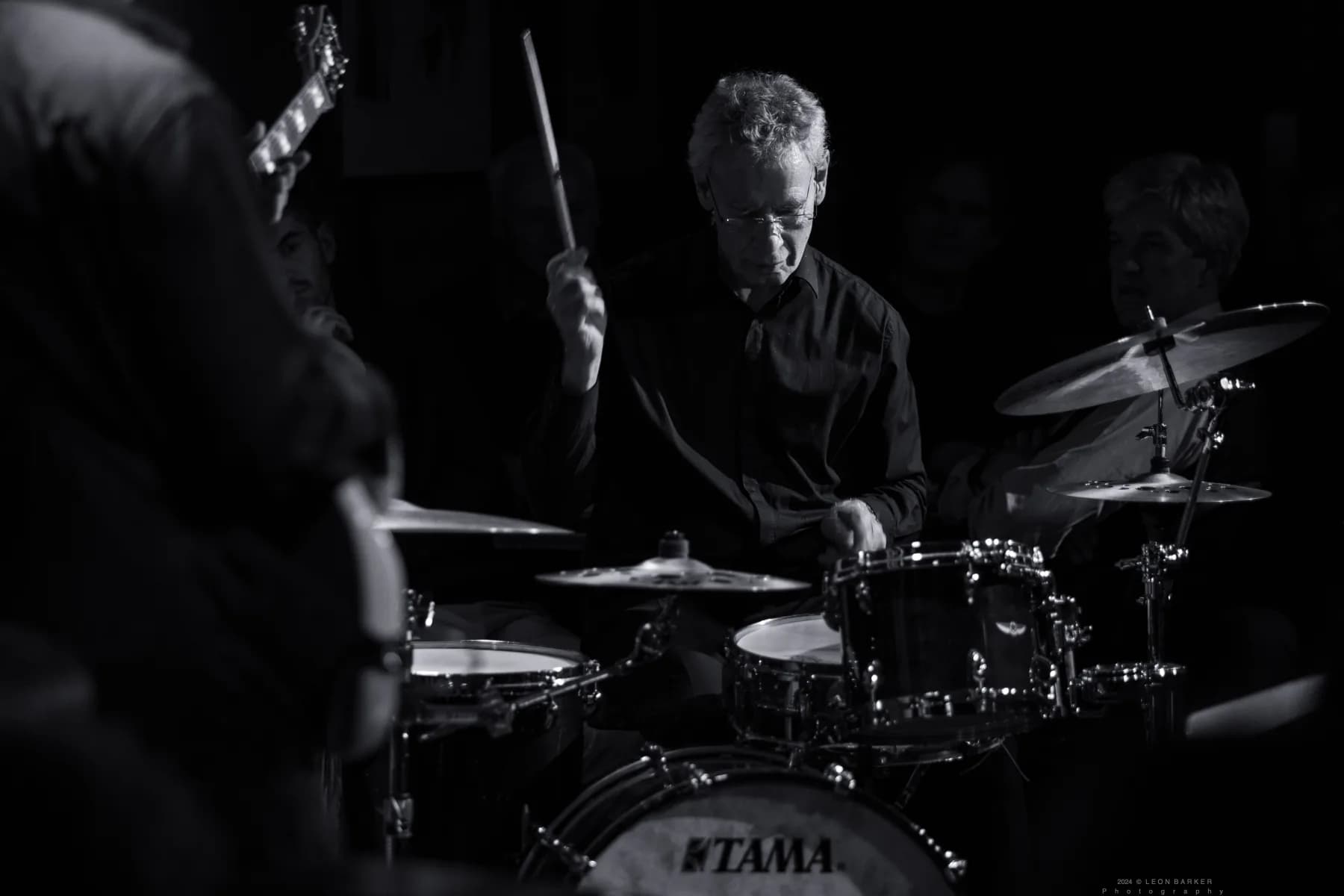 Pete Roth Trio playing a live jazz set in a dark venue.